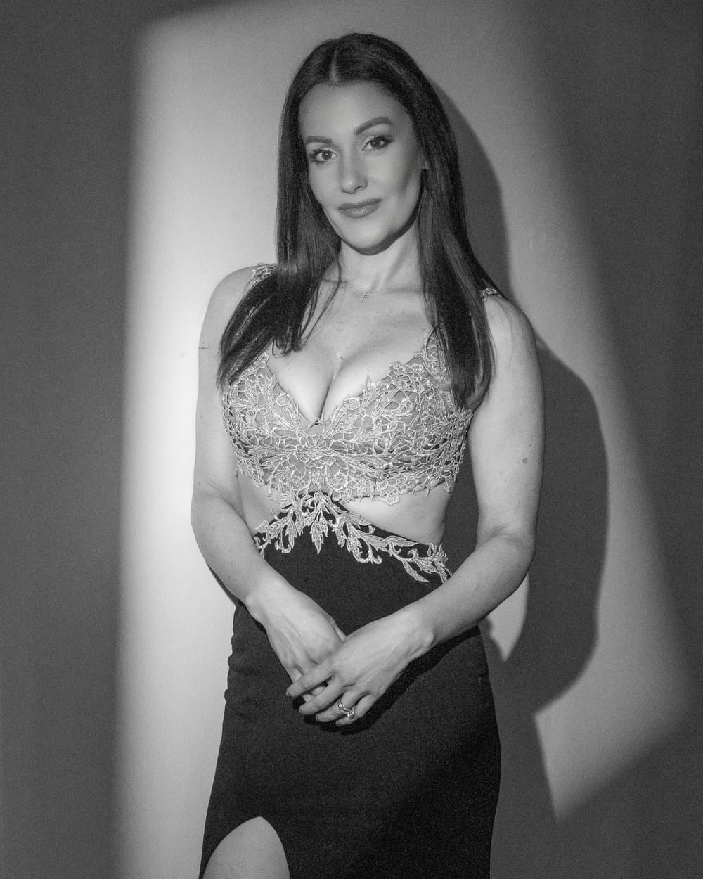 Black-and-white editorial in an embellished bodice and black skirt